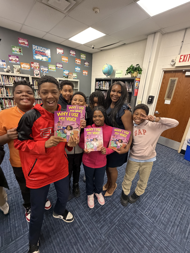 Precious Barry reads to RGSD scholars for Read Across America week. 