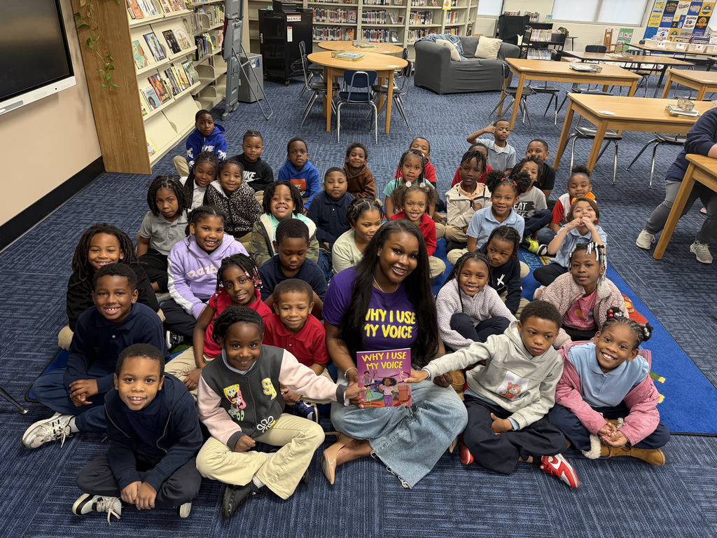 Precious Barry reads to RGSD scholars for Read Across America week. 