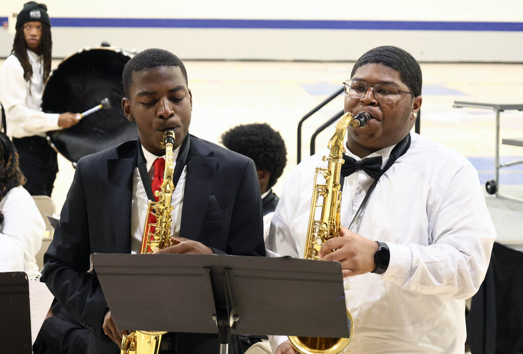 Two students play the saxophone during the RGHS spring concert