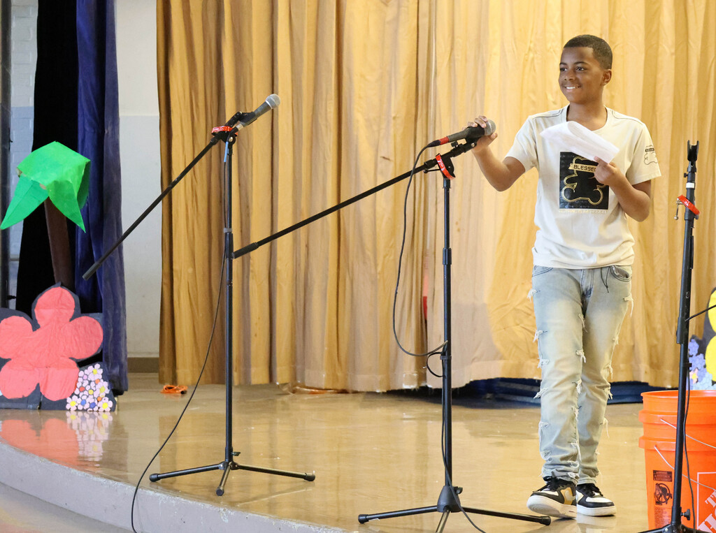 Student smiles during song