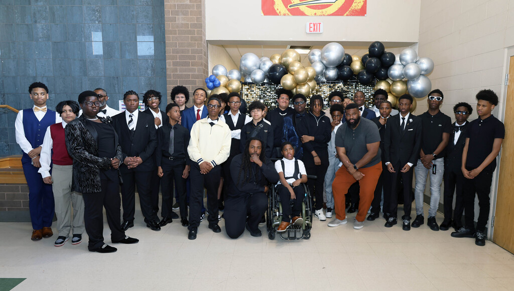 Male Westview students and staff members post for photo