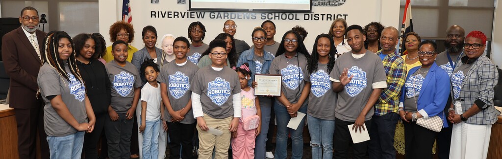 Central Middle School's Robotics Team and Coach Cheryl Howard receive the Riverview Excellence Award from the Board of Education. 