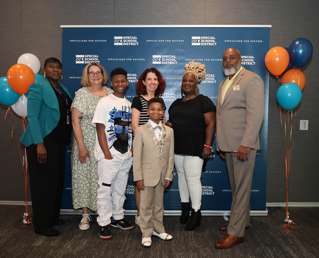 Da'Marion W with family and school leaders