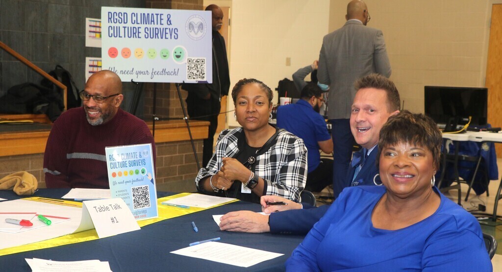 Attendees having discussion at DESE Public Hearing
