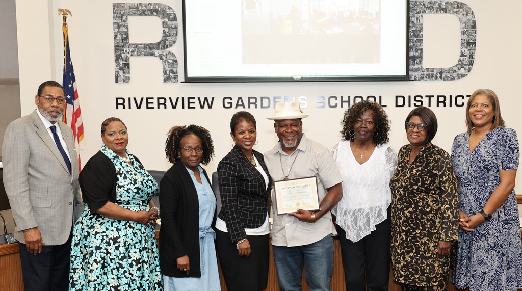 Sultan Muhammad receives the Riverview Excellence Award at the May 26 BOE meeting. 