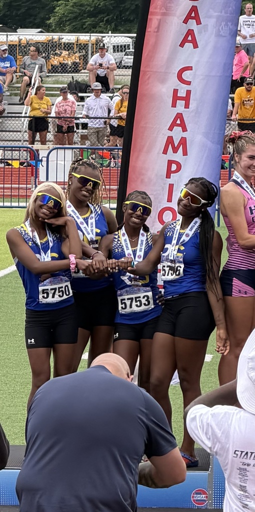 RGHS Lady Rams 4x1 relay team post on the podium