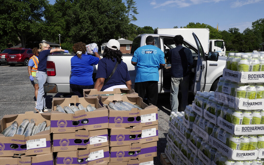 Volunteers load food into truck at RGSD's community food distribution event