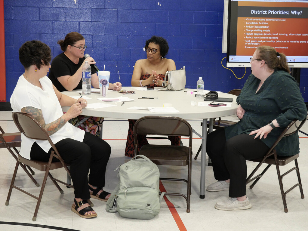 Women talking at Together for a Stronger Future Meeting