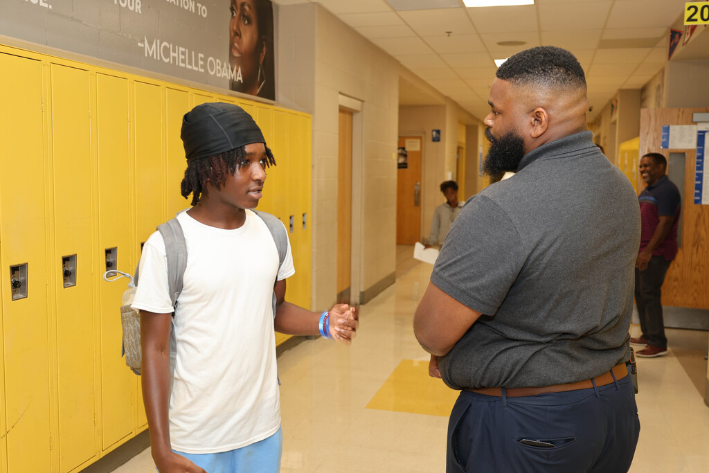Westview Middle School principal and student speaking in hallway