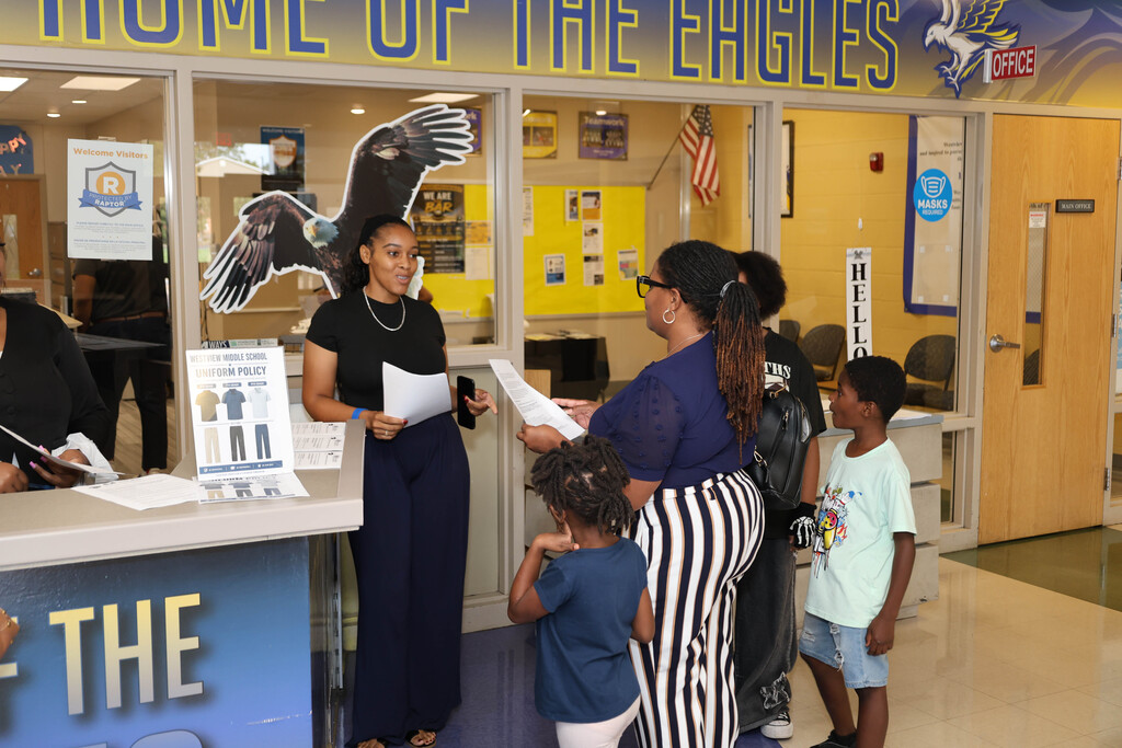 Family talking to Westview Middle School staff member