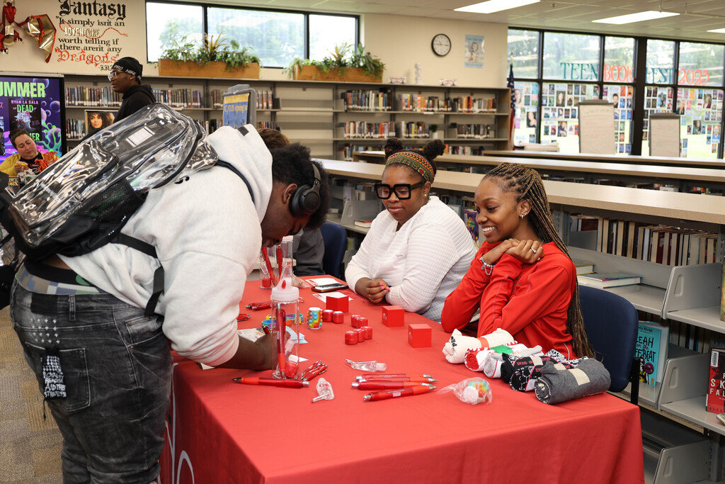 Freshman student signing up for more information about a student activity group