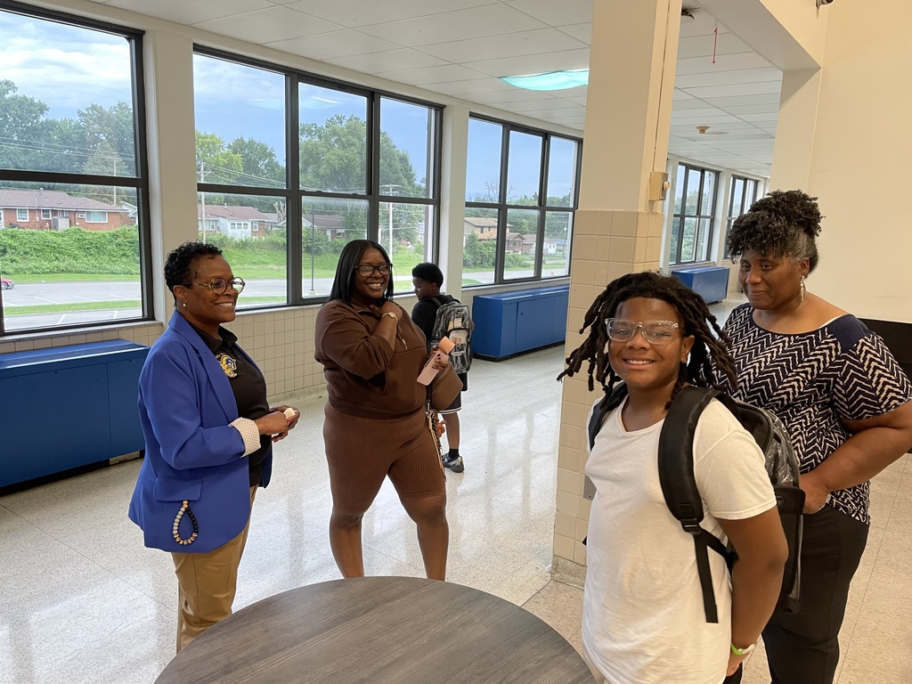 Smiling student and Central Middle School staff