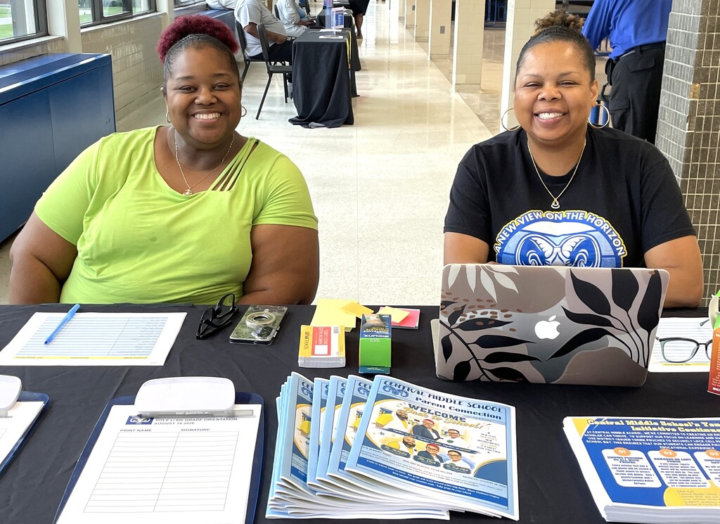 Central Middle School staff smiling at table