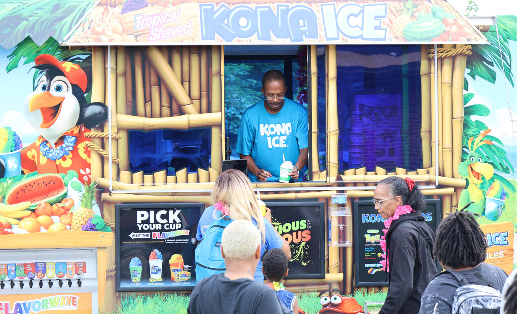 Families standing in line for snow cones