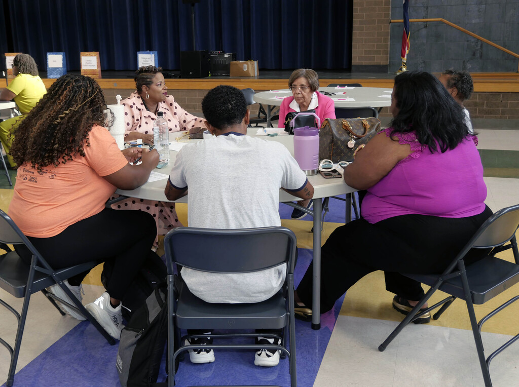 People sitting at roundtable