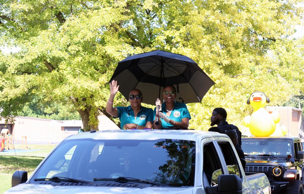 Moline Acres city officials wave to parade goers