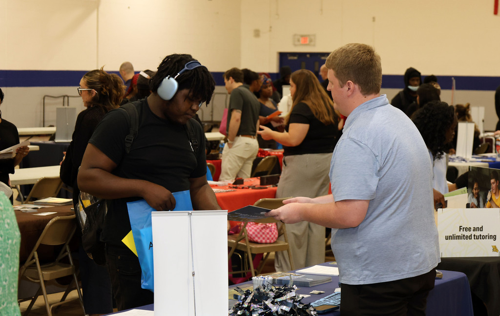 Students talk to college recruiter