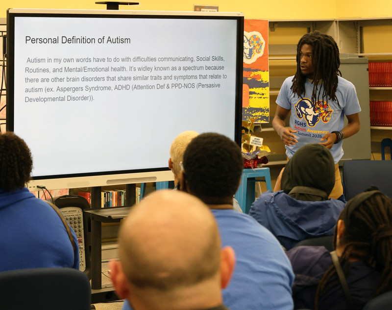 student making presentation for autism awareness summit