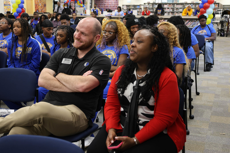 Staff and students watching speakers