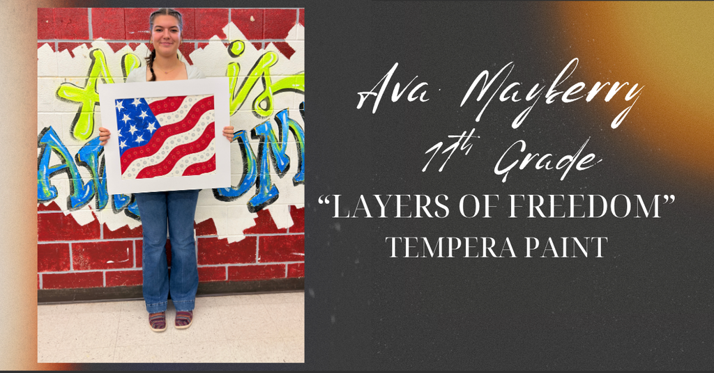 Ava holding up her artwork.