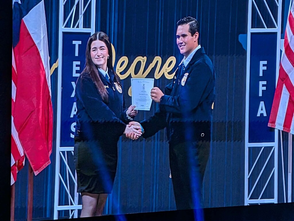 Anley receiving her award .