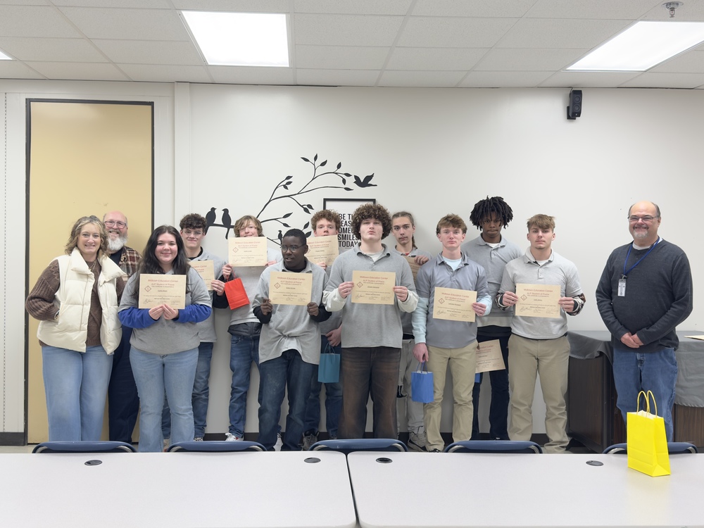 Students with principal, guidance counselor, and assistant principal