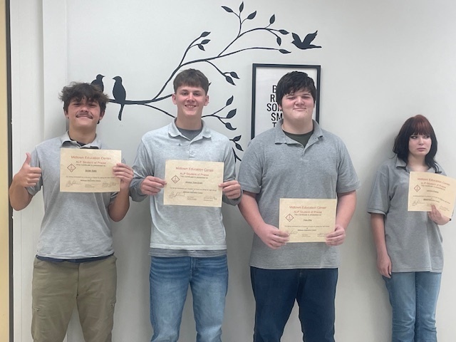 Students holding certificates