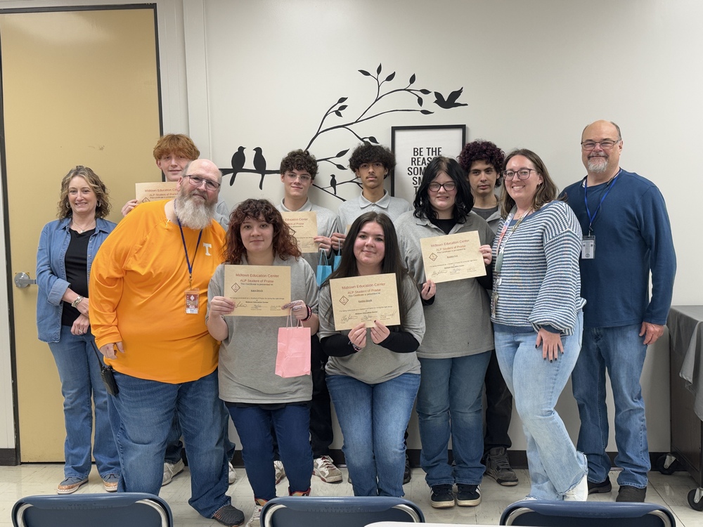 Students with principal, guidance counselor, and assistant principal