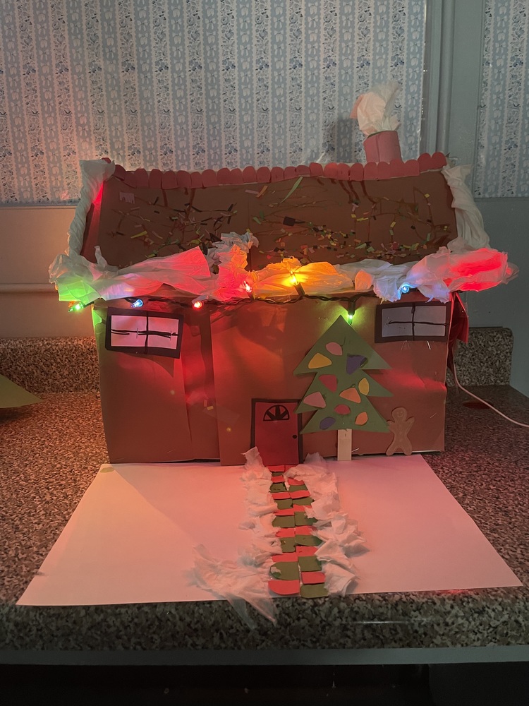 House with lights, tree, colored sidewalk