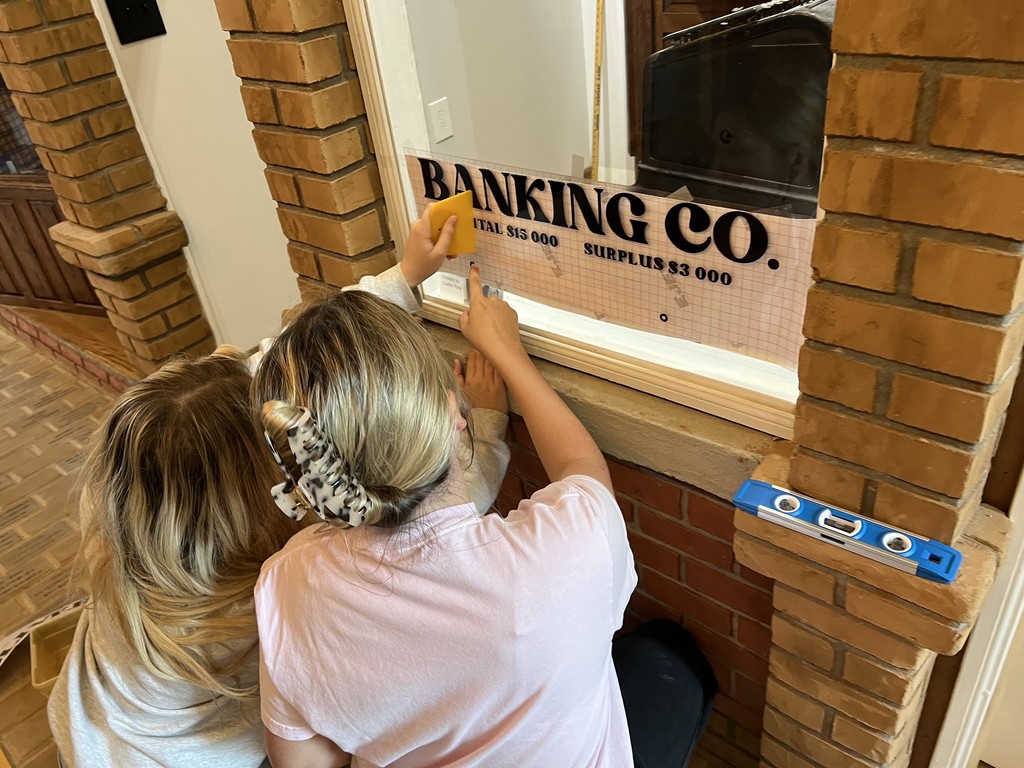Students installing sign