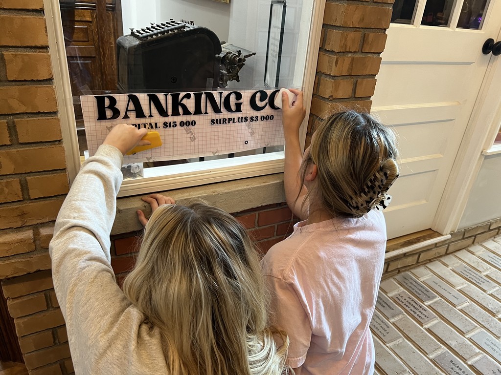 Students installing sign