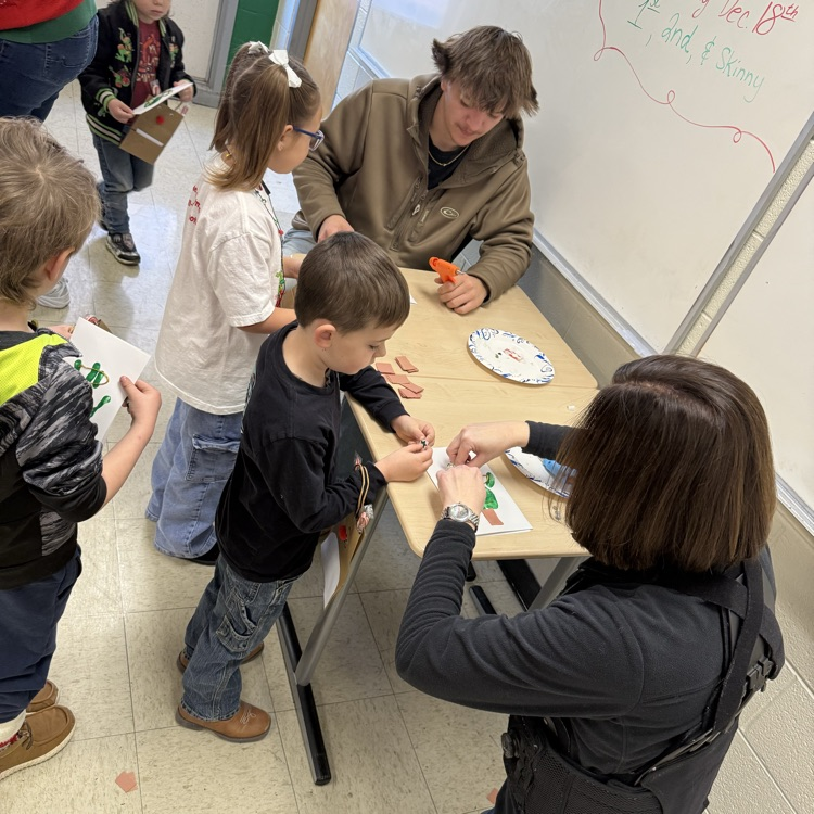 Mrs. Jones and Luke help with crafts!