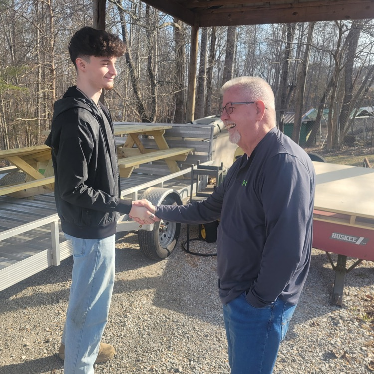 Braxton helps deliver picnic tables