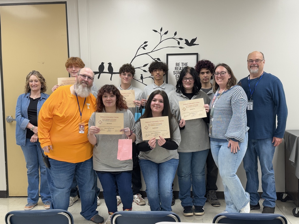 Students with principal, guidance counselor, and assistant principal