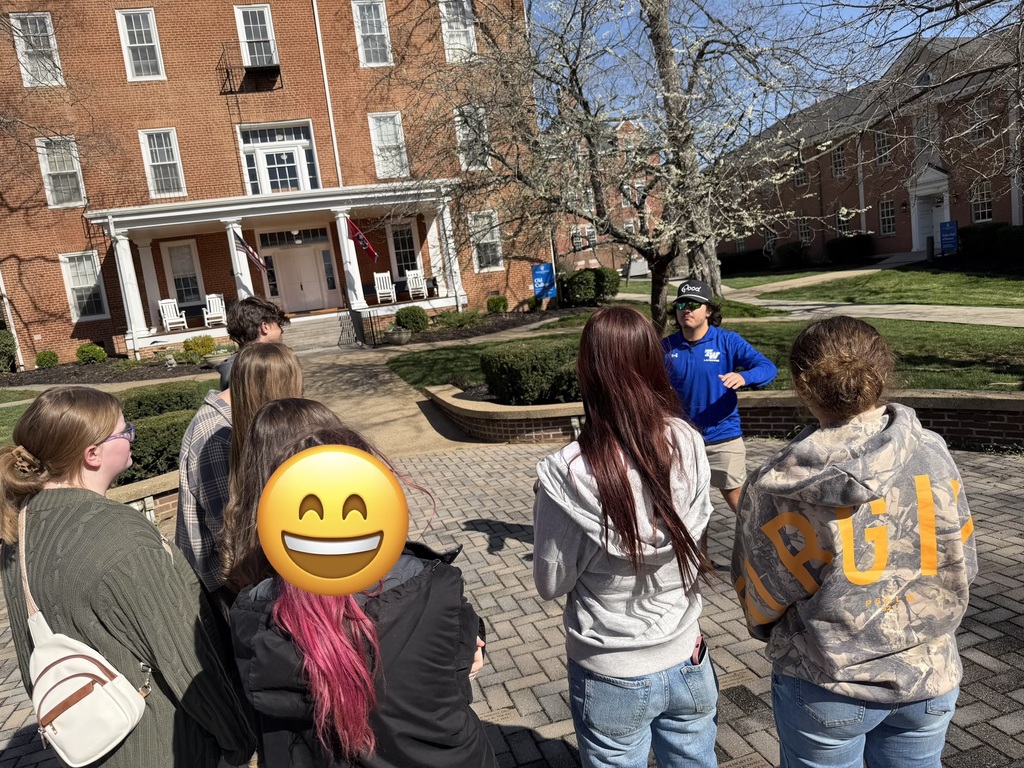 students listening to tour guide