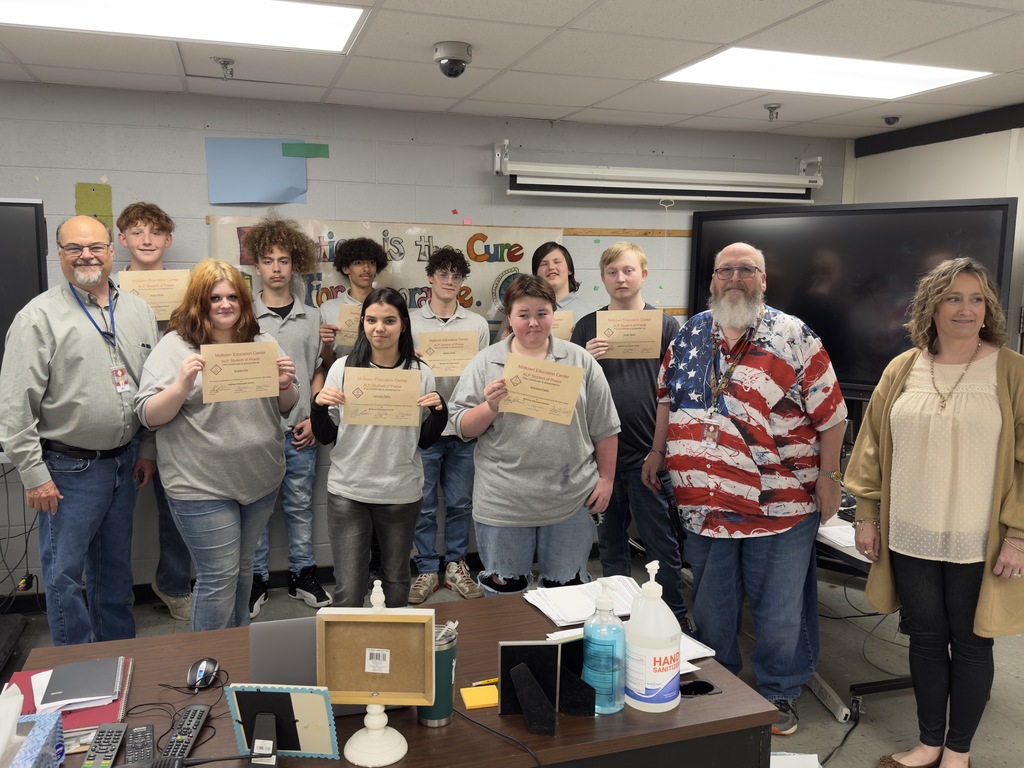 Students with principal, guidance counselor, and assistant principal