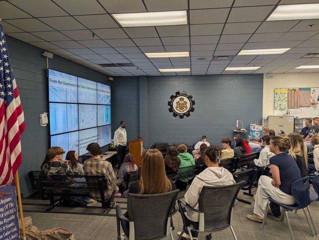 students listening to speaker