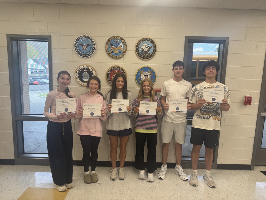 picture of students holding their certificates