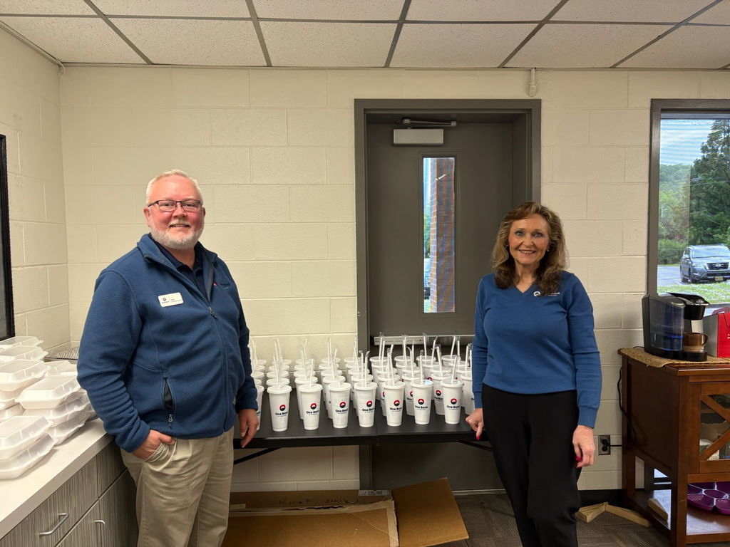 picture of bank employees with cups for tea