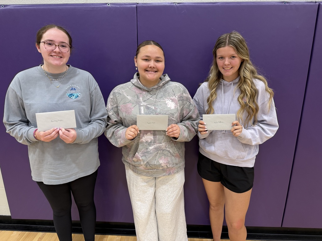 students holding their awards