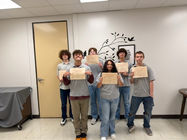students holding certificates