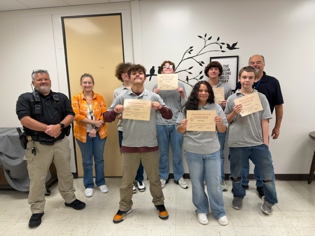 Students with principal, guidance counselor, and resource officer