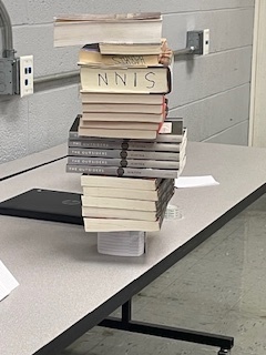 Books on top of index card structure