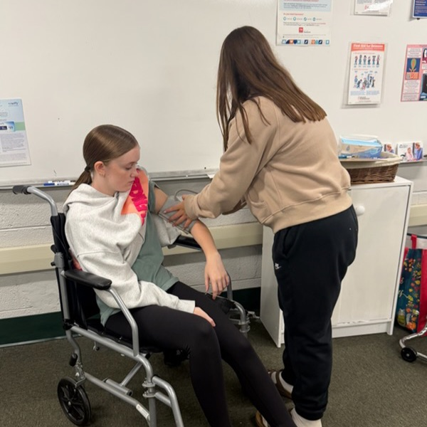 Learning to take blood pressure.
