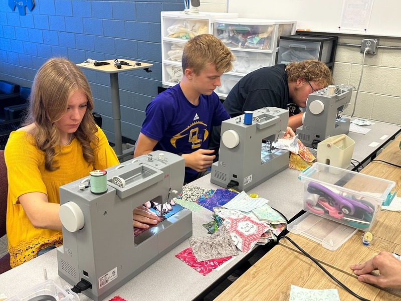 students working on sewing machines