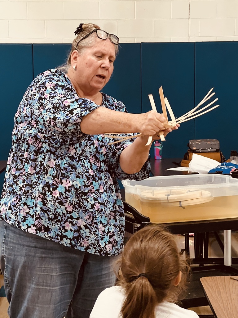 Ms. Shrekengost explaining basket making to us