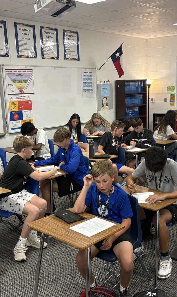 English I honors students work diligently to translate Shakespeare.