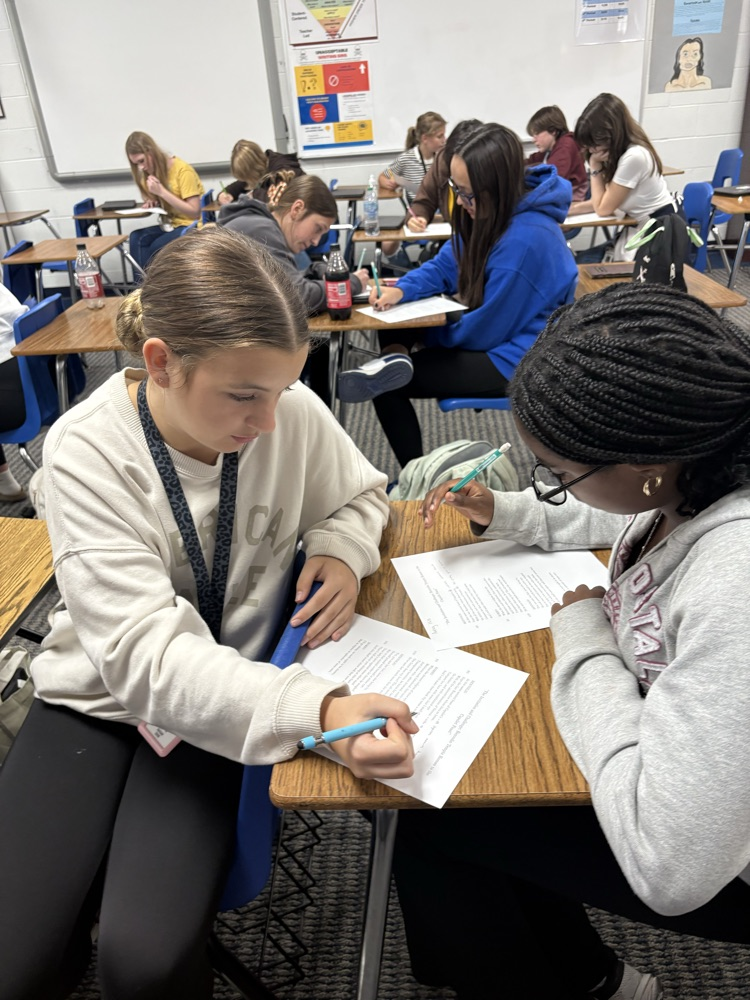 English I honors students work diligently to translate Shakespeare.