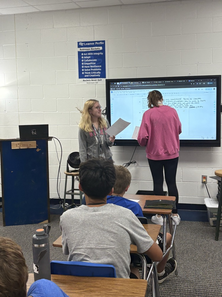 English I honors students work diligently to translate Shakespeare.