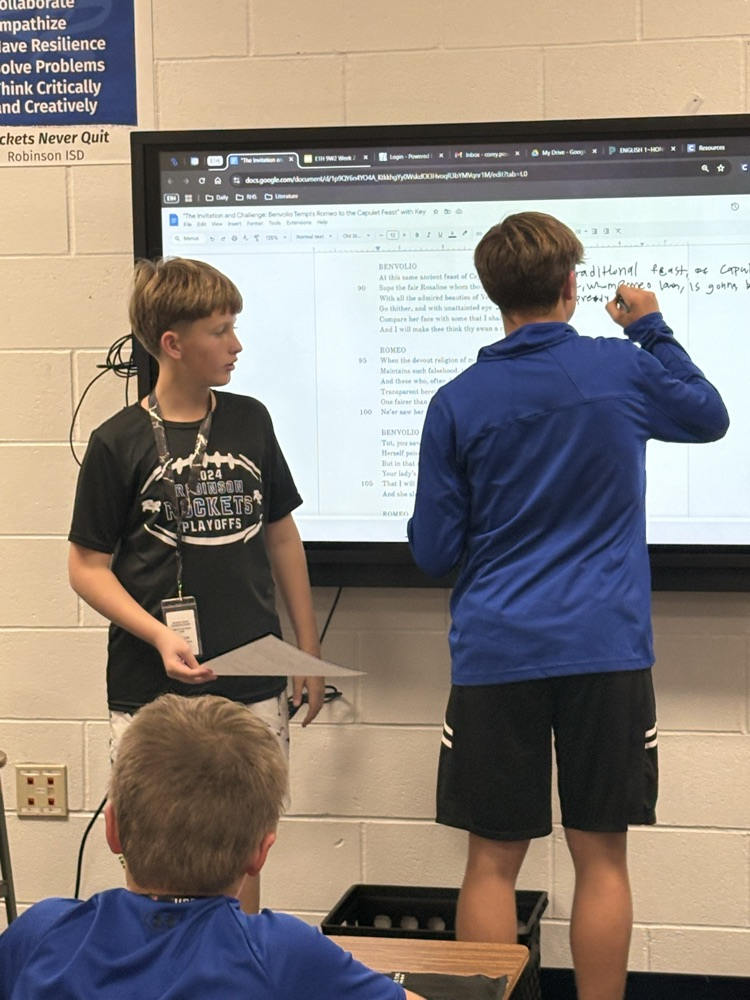 English I honors students work diligently to translate Shakespeare.